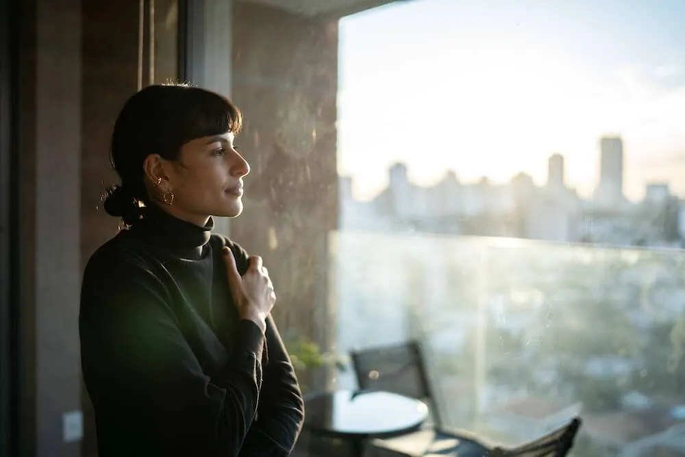 Woman sitting in front of a group Zoom call
