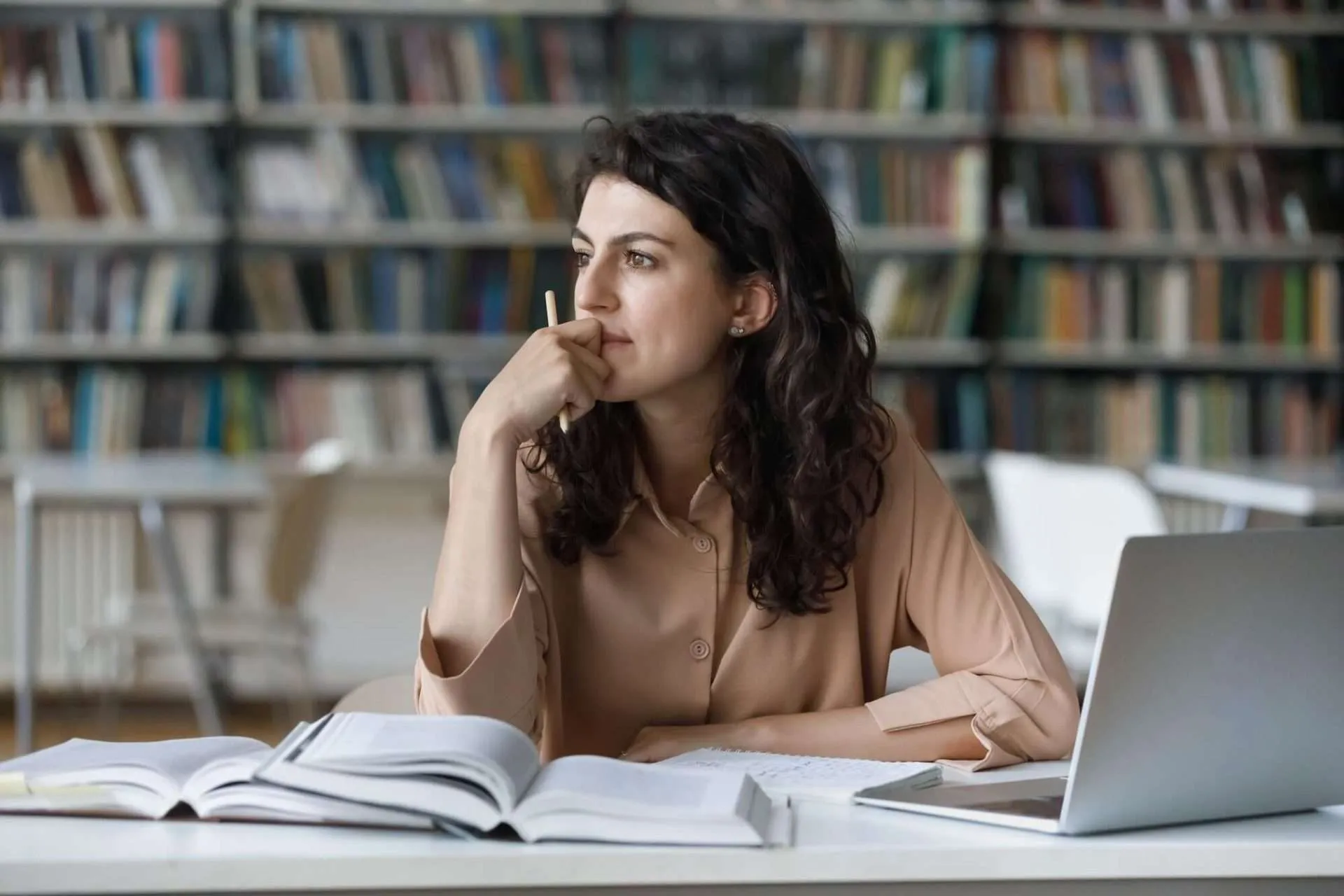 Woman sitting in front of a group Zoom call